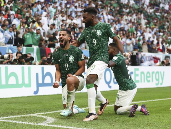 LUSAIL CITY, QATAR - NOVEMBER 22: Saleh Al-Shehri of Saudi Arabia celebrates with his team mates after scoring a goal to make it 1-1 during the FIFA World Cup Qatar 2022 Group C match between Argentina and Saudi Arabia at Lusail Stadium on November 22, 2022 in Lusail City, Qatar. (Photo by James Williamson - AMA/Getty Images)