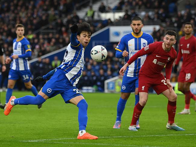 BRIGHTON, ENGLAND - JANUARY 29: Kaoru Mitoma of Brighton & Hove Albion tees the ball up to score the winning goal during the Emirates FA Cup Fourth Round match between Brighton & Hove Albion and Liverpool at Amex Stadium on January 29, 2023 in Brighton, England. (Photo by Mike Hewitt/Getty Images)
