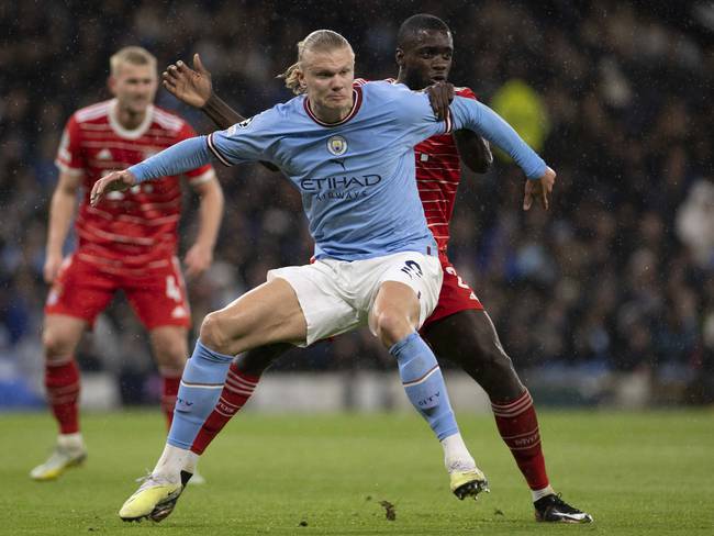 MANCHESTER, ENGLAND - APRIL 11: Dayot Upamecano of Bayern Munich and Erling Haaland of Manchester City battle for the ball during the UEFA Champions League quarterfinal first leg match between Manchester City and FC Bayern München at Etihad Stadium on April 11, 2023 in Manchester, England. (Photo by Richard Callis ATPImages/Getty Images)
