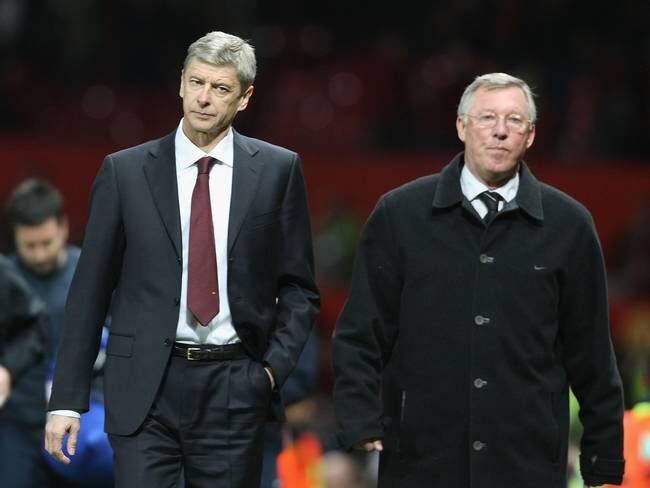 MANCHESTER, ENGLAND - APRIL 29: Managers Arsene Wenger of Arsenal and Sir Alex Ferguson of Manchester United walk off, at the final whistle of the UEFA Champions League Semi-Final first leg match between Manchester United and Arsenal at Old Trafford on April 29 2009, in Manchester, England. (Photo by Matthew Peters/Manchester United via Getty Images)