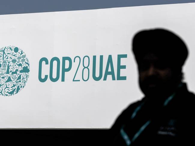Dubai (United Arab Emirates), 29/11/2023.- A man walks in front of the COP28 logo at Expo City Dubai, the venue of the 2023 United Nations Climate Change Conference (COP28), in Dubai, UAE, 29 November 2023. The 2023 United Nations Climate Change Conference (COP28), runs from 30 November to 12 December, and is expected to host one of the largest number of participants in the annual global climate conference as over 70,000 estimated attendees, including the member states of the UN Framework Convention on Climate Change (UNFCCC), business leaders, young people, climate scientists, Indigenous Peoples and other relevant stakeholders will attend. EFE/EPA/ALI HAIDER