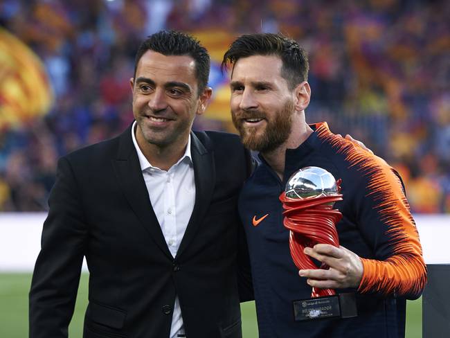 Xavi Hernández junto con Lionel Messi.  (Photo by Quality Sport Images/Getty Images)