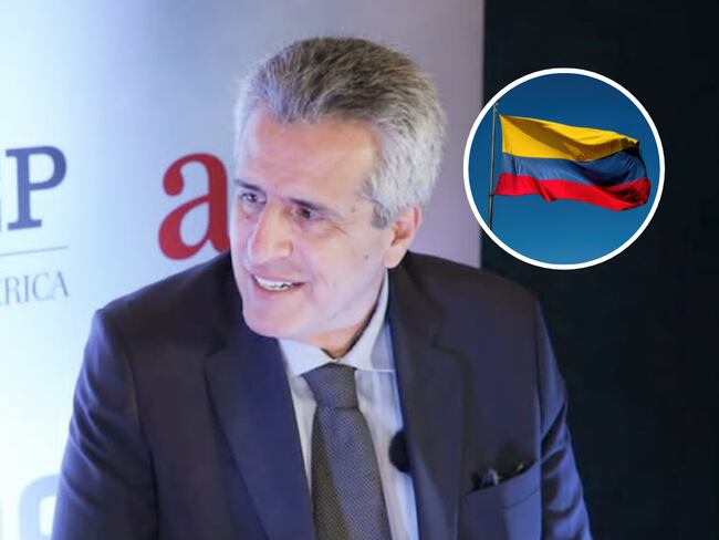 Ministro del Interior, Luis Fernando Velasco, y de fondo una bandera de Colombia..