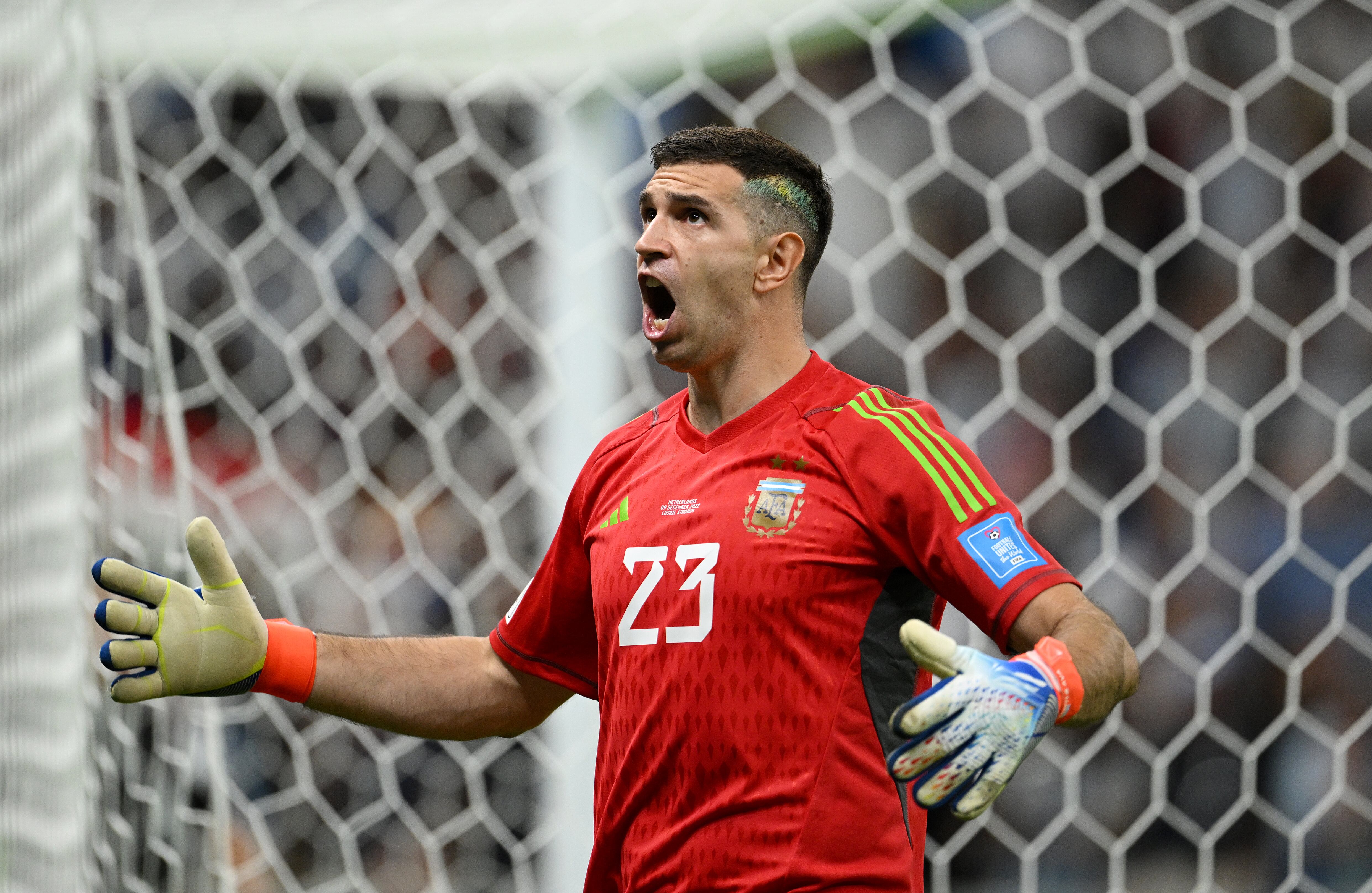 LUSAIL CITY, QATAR - DECEMBER 09: Emiliano Martinez of Argentina celebrates after saving a penalty by Virgil Van Dijk of Netherlands (not pictured) during the FIFA World Cup Qatar 2022 quarter final match between Netherlands and Argentina at Lusail Stadium on December 09, 2022 in Lusail City, Qatar. (Photo by Matthias Hangst/Getty Images)
