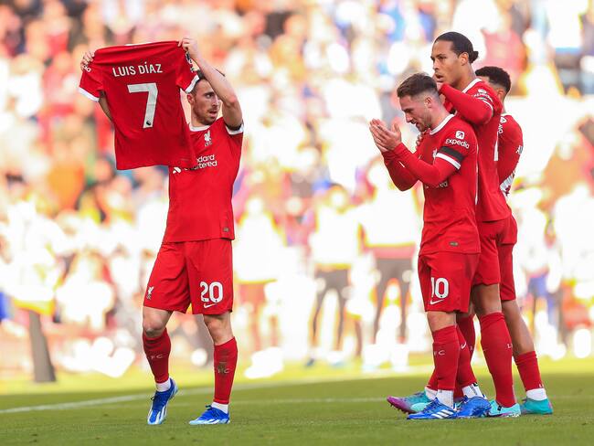 LIVERPOOL, ENGLAND - OCTOBER 29: Diogo Jota of Liverpool holds the shirt of teammate Luis Diaz after scoring their first goal to make the score 1-0 during the Premier League match between Liverpool FC and Nottingham Forest at Anfield on October 29, 2023 in Liverpool, England. (Photo by Daniel Chesterton/Offside/Offside via Getty Images)