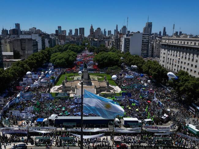 Aerial view of members of unions and social organizations taking part in a demonstration outside the Argentine Congress during a national strike against the government of Javier Milei in downtown Buenos Aires, on January 24, 2024. Argentine President Javier Milei faces the first national strike in just 45 days of government, against his draconian fiscal adjustment and his plan to reform more than a thousand laws and regulations that governed for decades. The largest Argentine union called the strike in rejection, in particular, of the changes by decree to the labor regime promoted by Milei, which limit the right to strike and affect the financing of unions. (Photo by Tomas CUESTA / AFP) (Photo by TOMAS CUESTA/AFP via Getty Images)
