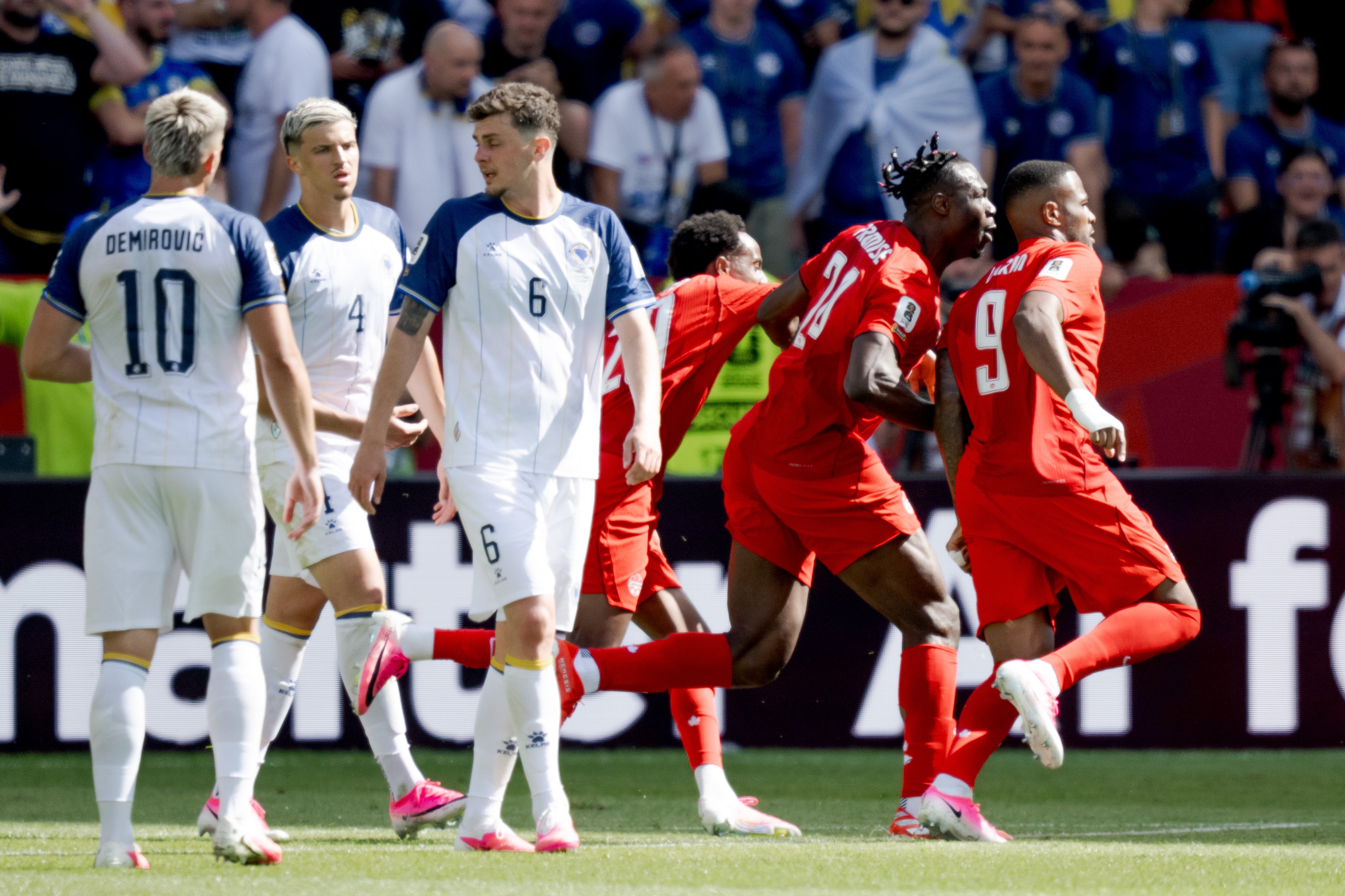 TORONTO, CANADA - JUNE 12: Cyle Larin of Canada celebrates 1-1 with Ali Ahmed of Canada, Promise David of Canada during the World Cup match between Canada v Bosnia and Herzegovina at the Toronto Stadium on June 12, 2026 in Toronto Canada (Photo by Jussi Eskola/Soccrates/Getty Images)