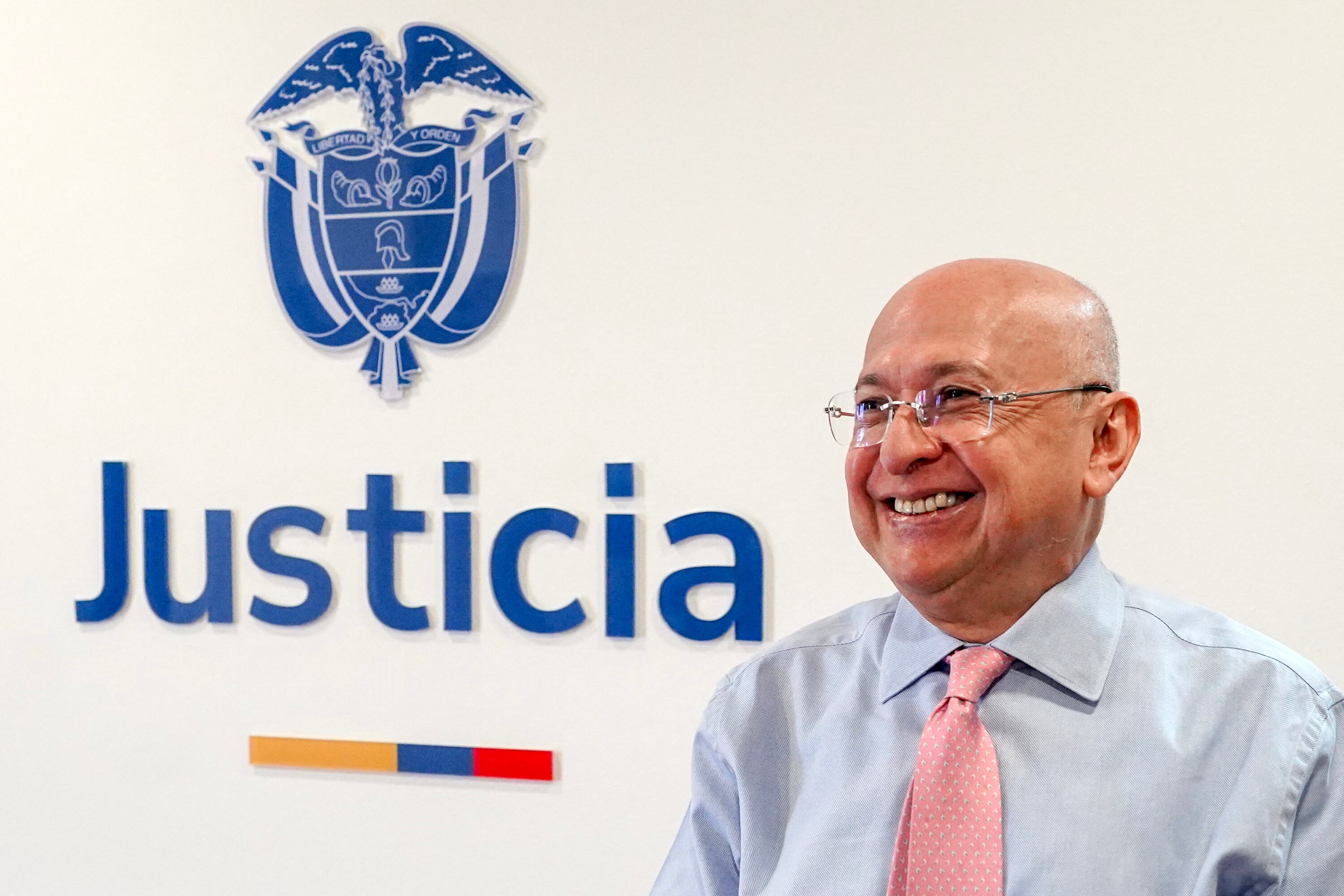 Colombia's Minister of Justice Eduardo Montealegre gestures during an interview with AFP in Bogota on June 26, 2025. The new Minister of Justice, Eduardo Montealegre, said that Colombia �will suspend the extradition� of criminals requested by the United States who are in peace talks with the government, although this could aggravate the rift between Washington and Bogota. (Photo by Anne-Sophie THILL / AFP)