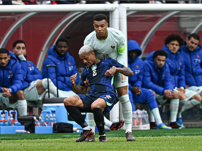 FOXBOROUGH, MASSACHUSETTS - MARCH 26: Kylian Mbappe #10 of France lifts Wesly Franca #2 of Brazil off the ground during the game between France and Brazil at Gillette Stadium on March 26, 2026 in Foxborough, Massachusetts. (Photo by Stephen Nadler/ISI Photos/ISI Photos via Getty Images)