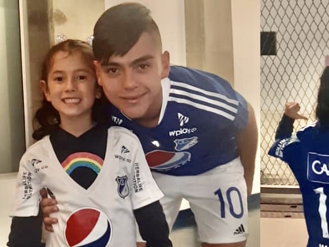Daniel Ruíz posa junto a la pequeña Luciana, quien recibió la camiseta del volante de Millonarios.