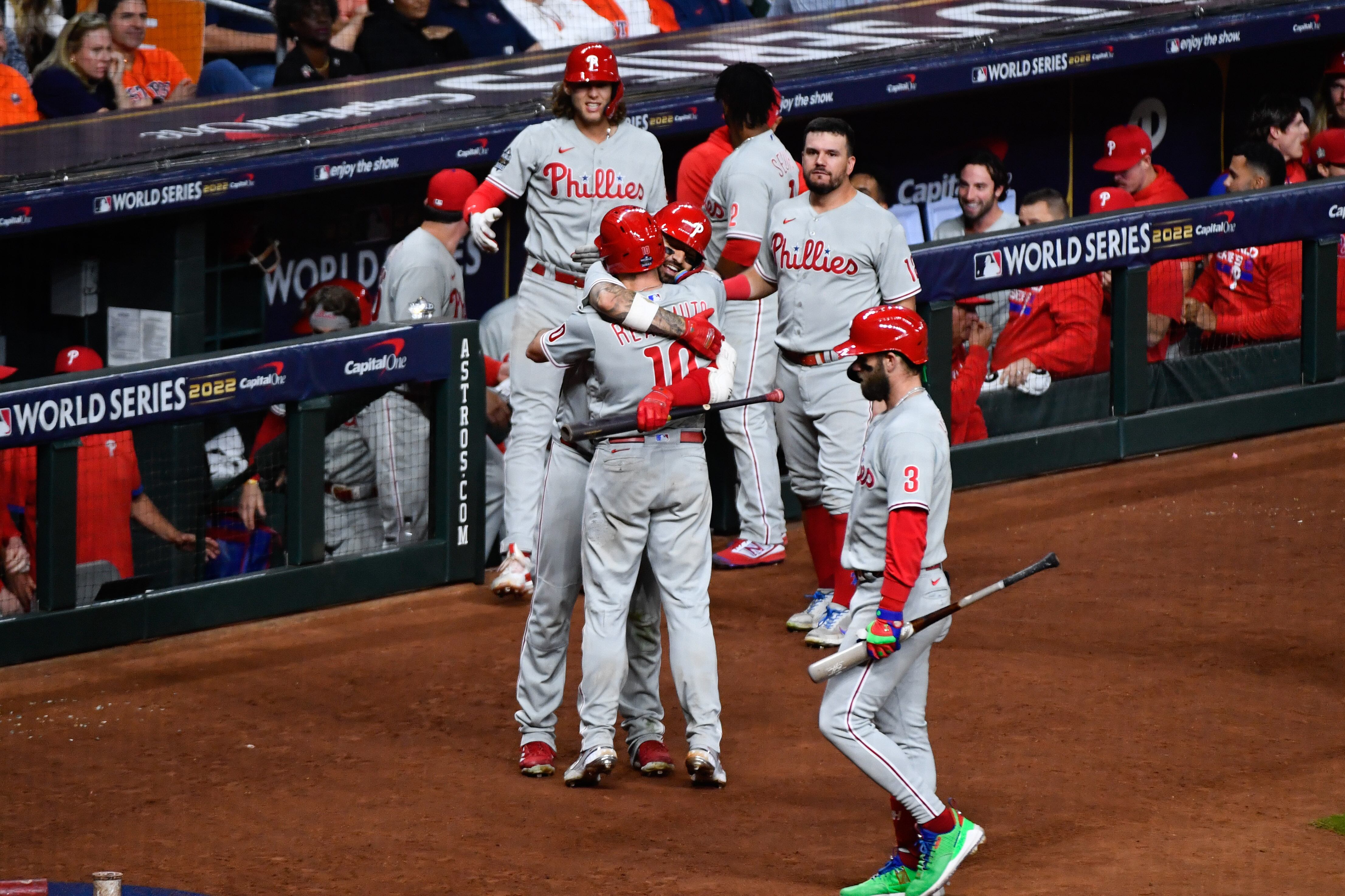 HOUSTON, TX - OCTOBER 28:   J.T. Realmuto #10 of the Philadelphia Phillies hugs Nick Castellanos #8 after hitting a home run in the tenth inning to take the lead during Game 1 of the 2022 World Series between the Philadelphia Phillies and the Houston Astros at Minute Maid Park on Friday, October 28, 2022 in Houston, Texas. (Photo by Logan Riely/MLB Photos via Getty Images)