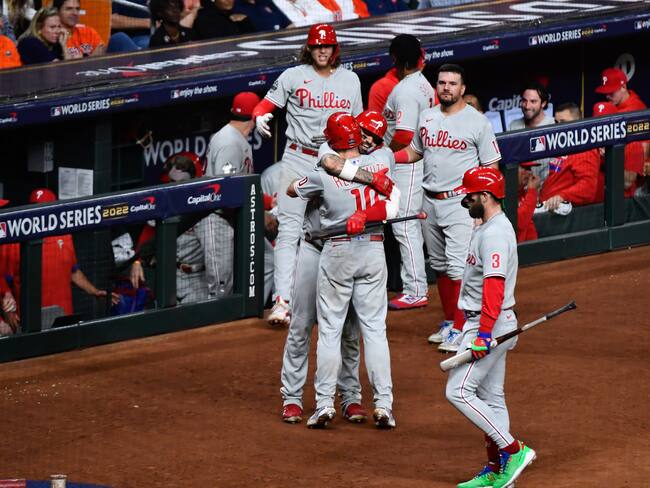 HOUSTON, TX - OCTOBER 28: J.T. Realmuto #10 of the Philadelphia Phillies hugs Nick Castellanos #8 after hitting a home run in the tenth inning to take the lead during Game 1 of the 2022 World Series between the Philadelphia Phillies and the Houston Astros at Minute Maid Park on Friday, October 28, 2022 in Houston, Texas. (Photo by Logan Riely/MLB Photos via Getty Images)