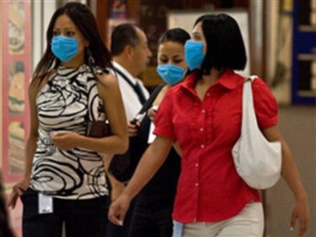 Expertos decidirán el martes si aumentan el nivel de alerta por gripe porcina
