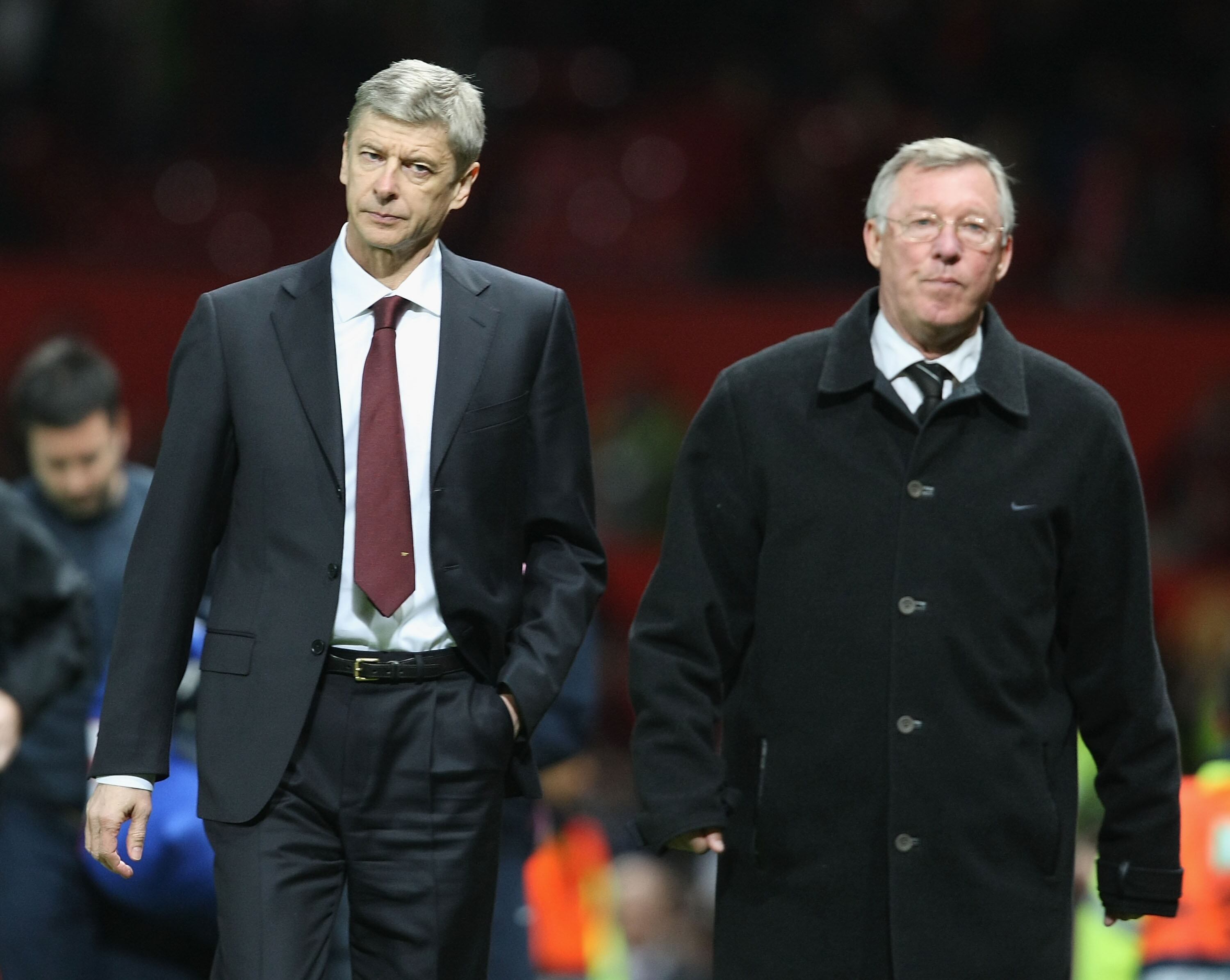 MANCHESTER, ENGLAND - APRIL 29: Managers Arsene Wenger of Arsenal and Sir Alex Ferguson of Manchester United walk off, at the final whistle of the UEFA Champions League Semi-Final first leg match between Manchester United and Arsenal at Old Trafford on April 29 2009, in Manchester, England. (Photo by Matthew Peters/Manchester United via Getty Images)
