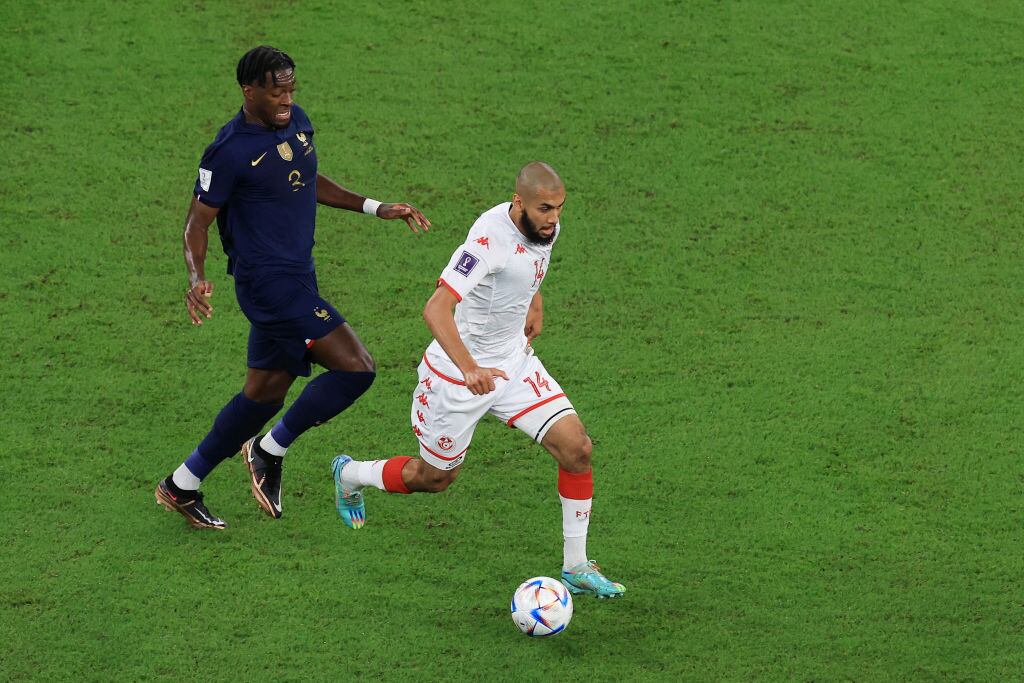 AL RAYYAN, QATAR - NOVEMBER 30: Aissa Laidouni of Tunisia battles for possession with Axel Disasi of France during the FIFA World Cup Qatar 2022 Group D match between Tunisia and France at Education City Stadium on November 30, 2022 in Al Rayyan, Qatar. (Photo by Buda Mendes/Getty Images)