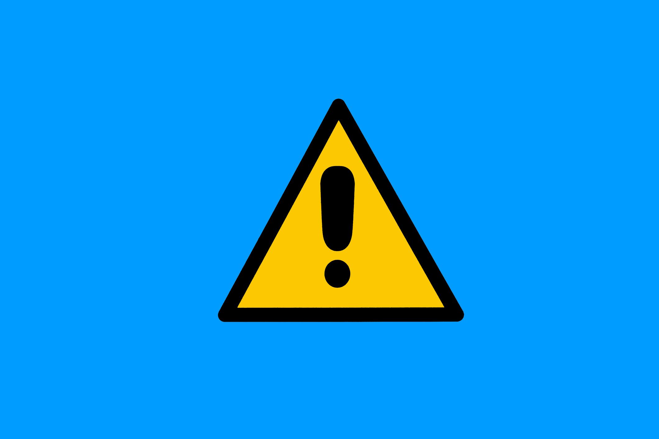 Warning sign with yellow and black triangle with exclamation mark, on blue background. Danger, risk, caution, attention, road sign and care concept.