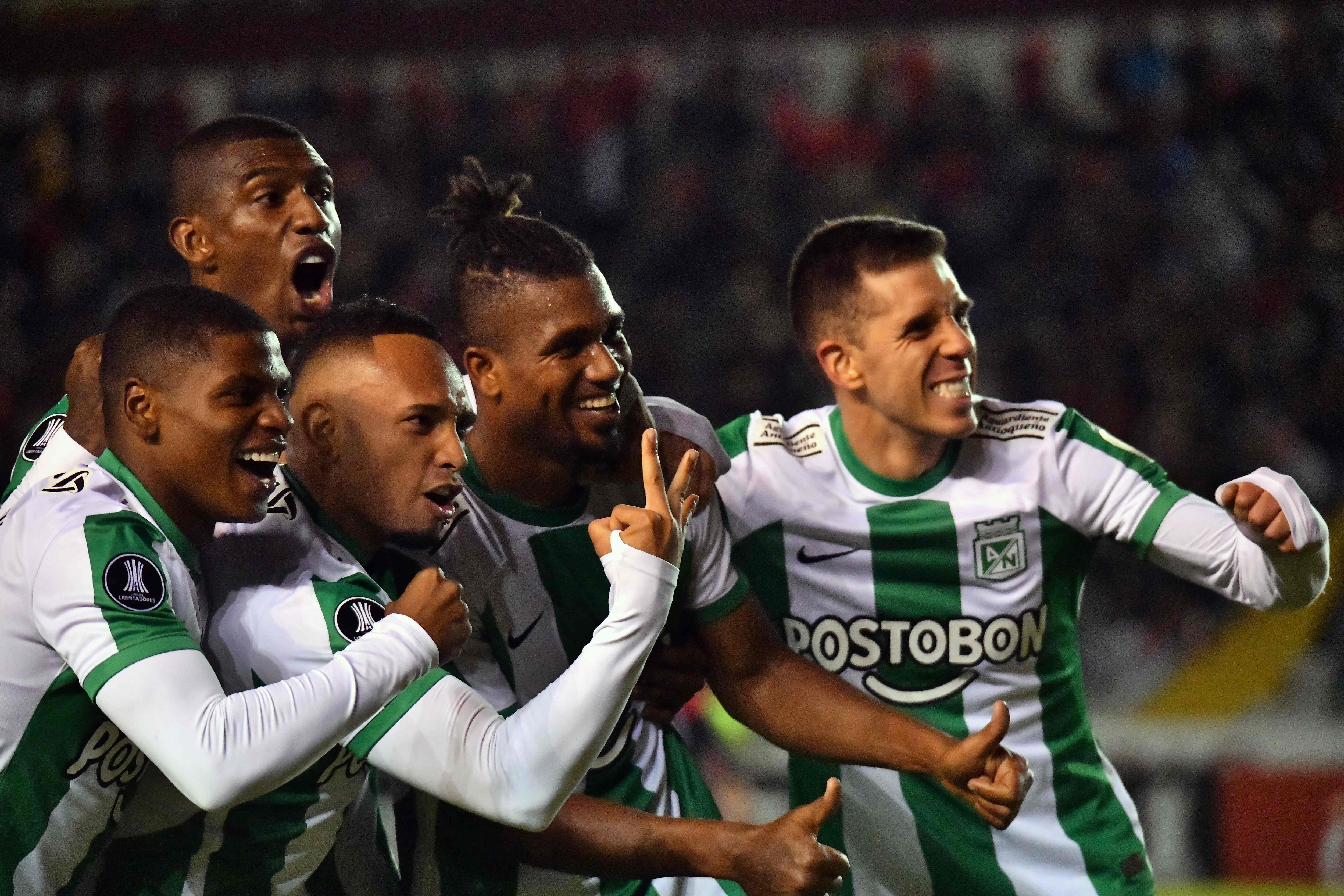 Atletico Nacional's midfielder Danovis Banguero (C) celebrates with teammates after scoring during the Copa Libertadores group stage second leg football match between Peru's Melgar and Colombia's Atletico Nacional, at the UNSA Monumental stadium in Arequipa, Peru, on May 24, 2023. (Photo by Diego Ramos / AFP) (Photo by DIEGO RAMOS/AFP via Getty Images)