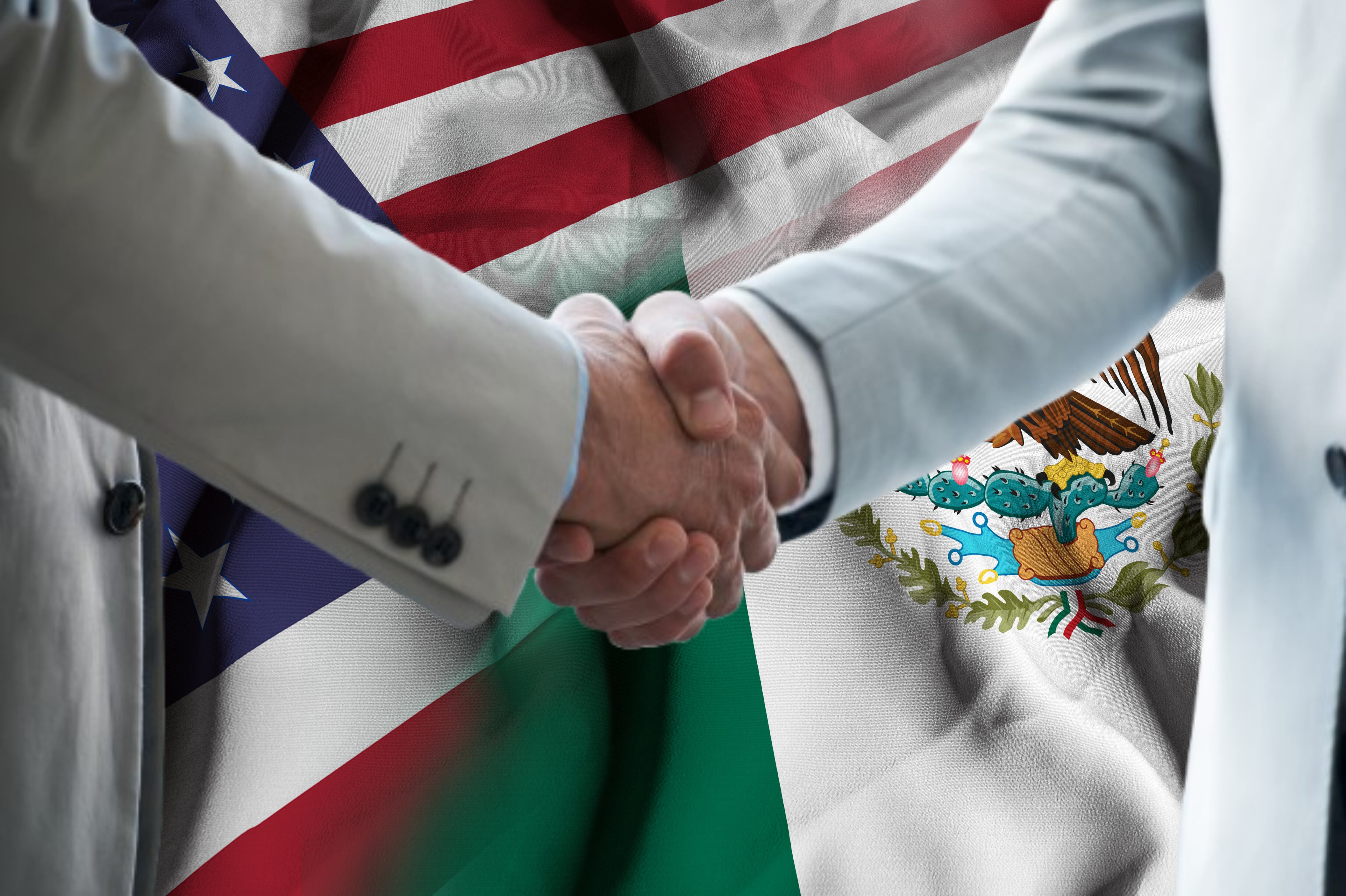 Imagen de referencia. Banderas Mexico y Estados Unidos / Apretón de manos de negociación: Getty Images.