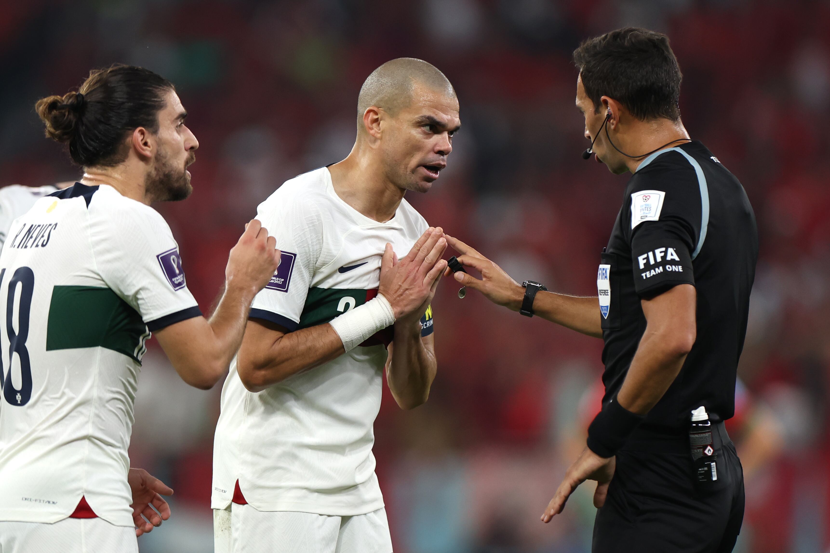 DOHA, QATAR - DECEMBER 10: Referee Facundo Tello speaks to Pepe of Portugal after an incident during the FIFA World Cup Qatar 2022 quarter final match between Morocco and Portugal at Al Thumama Stadium on December 10, 2022 in Doha, Qatar. (Photo by Francois Nel/Getty Images)