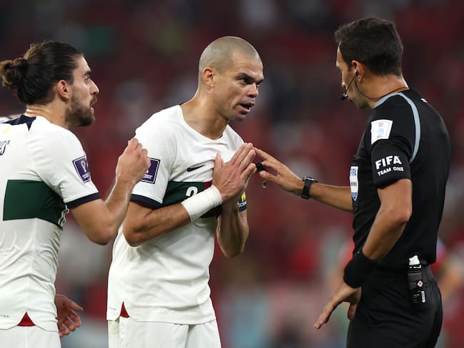 DOHA, QATAR - DECEMBER 10: Referee Facundo Tello speaks to Pepe of Portugal after an incident during the FIFA World Cup Qatar 2022 quarter final match between Morocco and Portugal at Al Thumama Stadium on December 10, 2022 in Doha, Qatar. (Photo by Francois Nel/Getty Images)