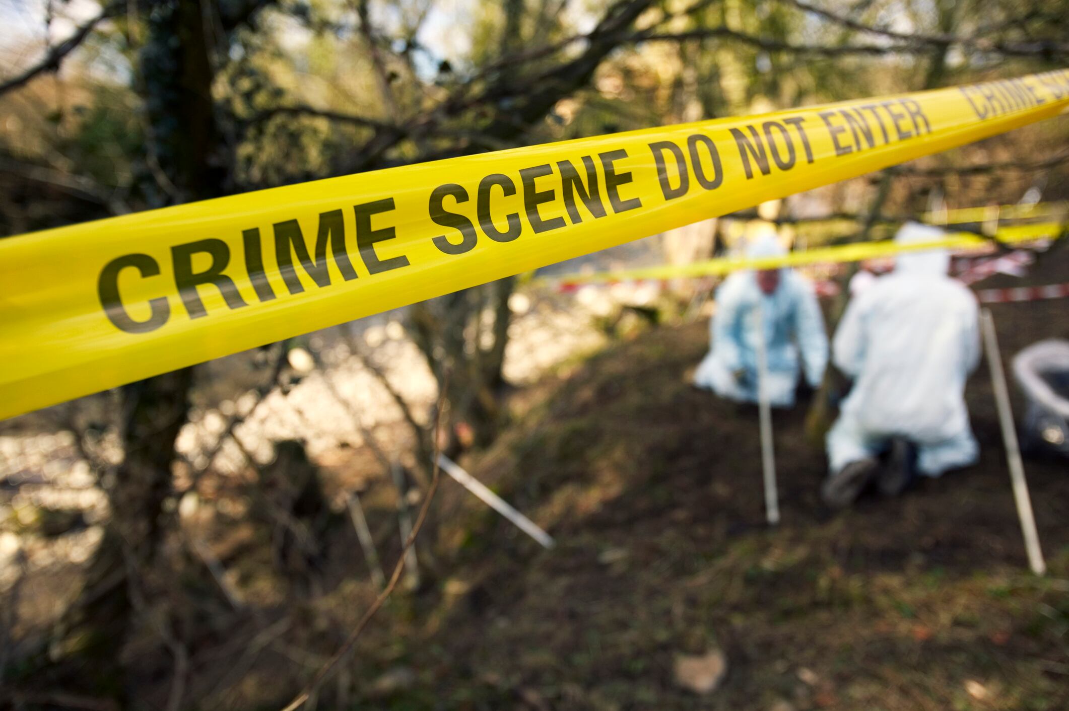 Police crime scene investigators look for evidence at the burial site of Shafelia Ahmed. 17-year-old Shafelia went missing from her home in Sept. 2003. Her body was found in a shallow grave on the banks of the River Kent. She had confided in school friends that she was terrified of being forced into an arranged marriage, and disappeared on 2 occasions with a boy, in Oct. and Feb. 2003. On those occasions her parents, father Iftikhar and mother Farzana, reported her missing. When she disappeared in September they did not report her missing. Her parents were arrested in Dec. 2003 on suspicion but released on police bail. They denied any involvement in their daughter?s murder, which police believe was an ?honour killing?. At a recent inquest, pathologist Dr. Alison Armour said it was not credible that Shafelia had died of natural causes.