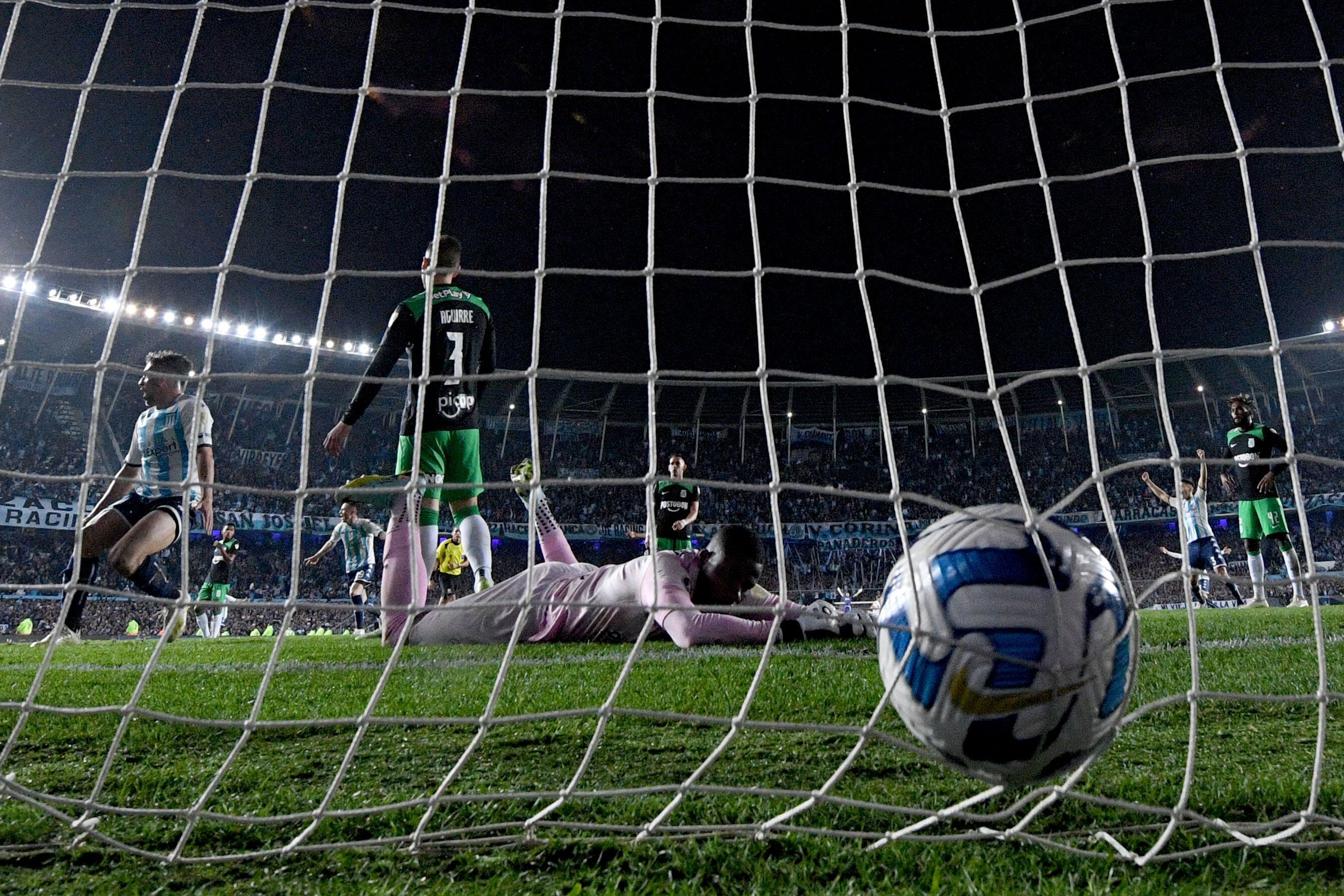 Atletico Nacional's defender Felipe Aguirre (2-L) scores an own goal during the Copa Libertadores round of 16 second leg football match between Argentina's Racing Club and Colombia's Atletico Nacional, at the Presidente Juan Domingo Peron (El Cilindro) stadium, in Buenos Aires, on August 10, 2023. (Photo by Luis ROBAYO / AFP) (Photo by LUIS ROBAYO/AFP via Getty Images)