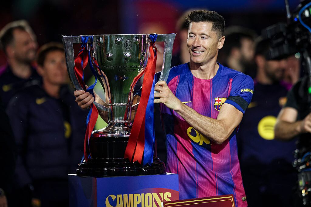 Robert Lewandowski of FC Barcelona holds the La Liga championship trophy during the La Liga EA Sports 2025/26 ''El Clasico'' match between FC Barcelona and Real Madrid at Spotify Camp Nou Stadium in May 2026 in Barcelona, Spain. (Photo by Gongora/NurPhoto via Getty Images)