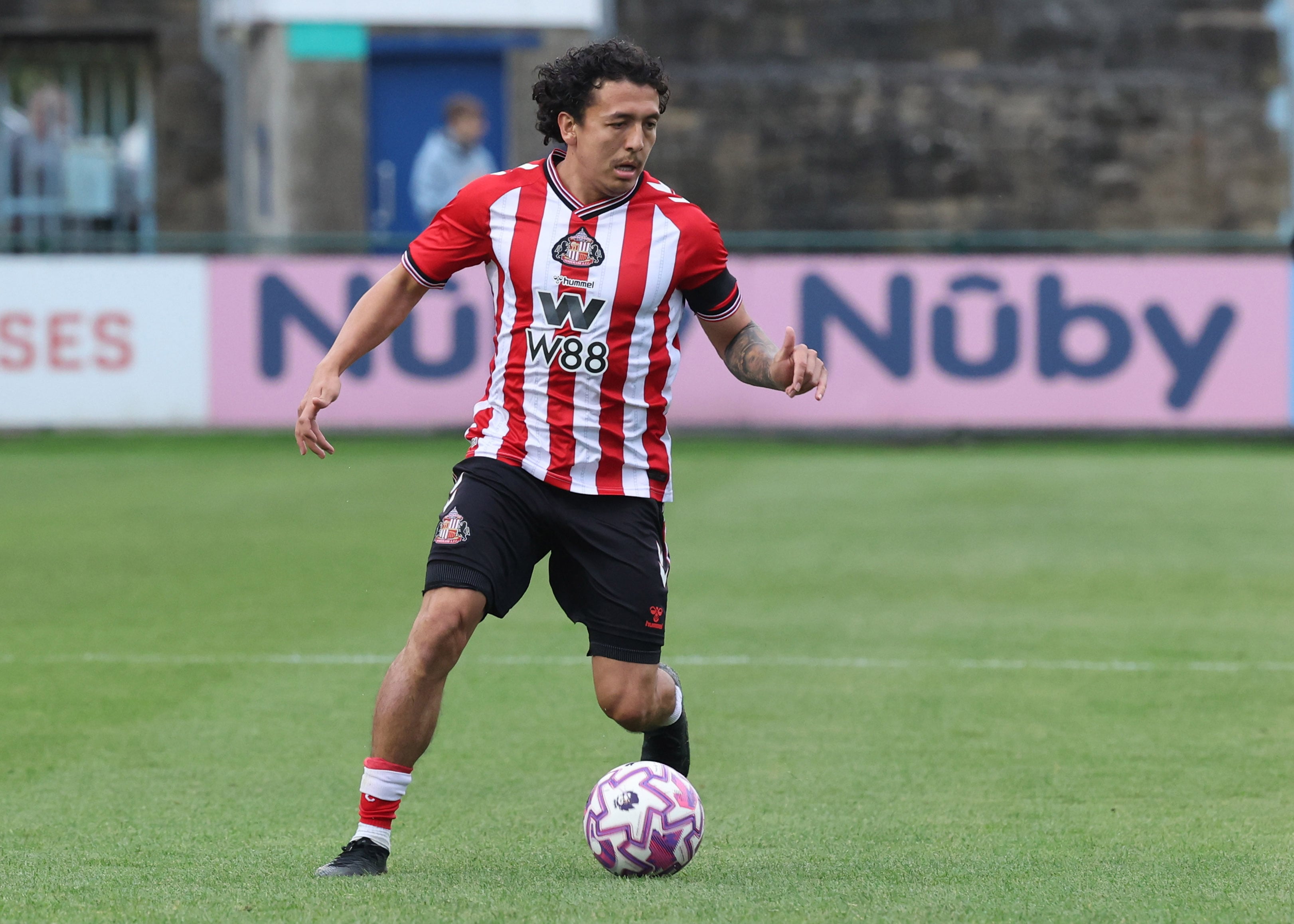 HETTON-LE-HOLE, ENGLAND - AUGUST 18: Ian Poveda of Sunderland runs with the ball during the Premier League 2 match between Sunderland U21 and Spurs U21 at Eppleton Colliery Welfare Ground on August 18, 2025 in Hetton-le-Hole, England. (Photo by Ian Horrocks/Sunderland AFC via Getty Images)