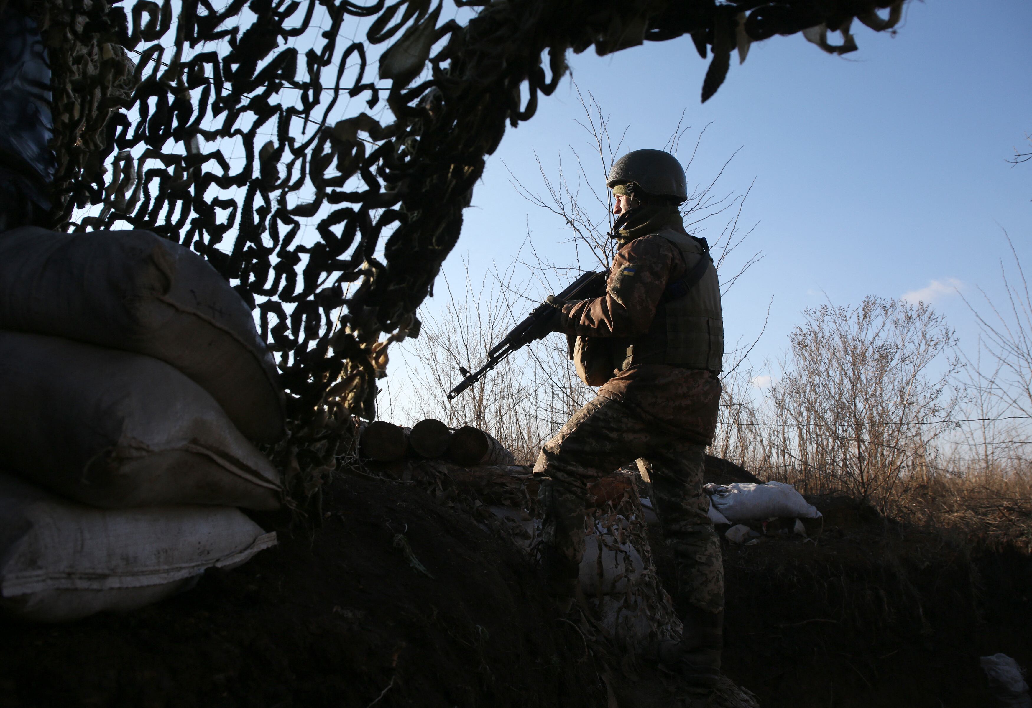 A Ukrainian serviceman keeps watch at a position on the frontline with Russia-backed separatists not far from Gorlivka, Donetsk region, on November 25, 2021. (Photo by Anatolii STEPANOV / AFP) (Photo by ANATOLII STEPANOV/AFP via Getty Images)
