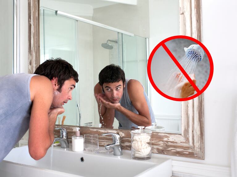 Hombre afeitándose y una señal de prohibido con una dicha de fondo (Fotos vía Getty Images)