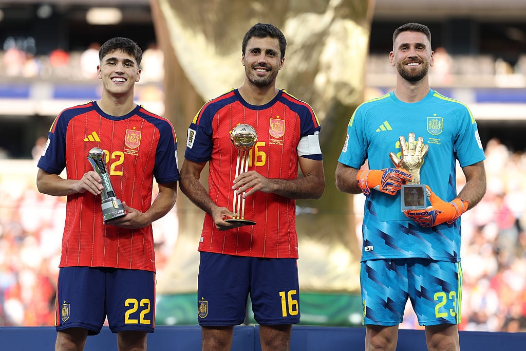 EAST RUTHERFORD, NEW JERSEY - JULY 19: Pau Cubarsi #22, Rodri #16 and Unai Simon #23 of Spain pose with their awards after the FIFA World Cup 2026 Final match between Spain and Argentina at New York New Jersey Stadium on July 19, 2026 in East Rutherford, New Jersey. (Photo by Alex Pantling - FIFA/FIFA via Getty Images)