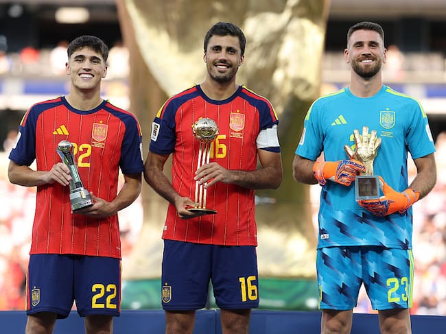 EAST RUTHERFORD, NEW JERSEY - JULY 19: Pau Cubarsi #22, Rodri #16 and Unai Simon #23 of Spain pose with their awards after the FIFA World Cup 2026 Final match between Spain and Argentina at New York New Jersey Stadium on July 19, 2026 in East Rutherford, New Jersey. (Photo by Alex Pantling - FIFA/FIFA via Getty Images)