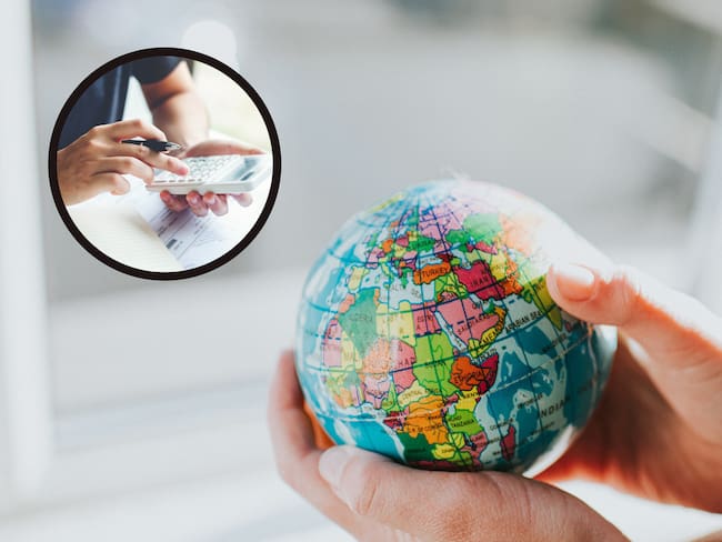 Individuo sosteniendo el mapa del mundo en sus manos junto a alguien que usa una calculadora (Getty Images)