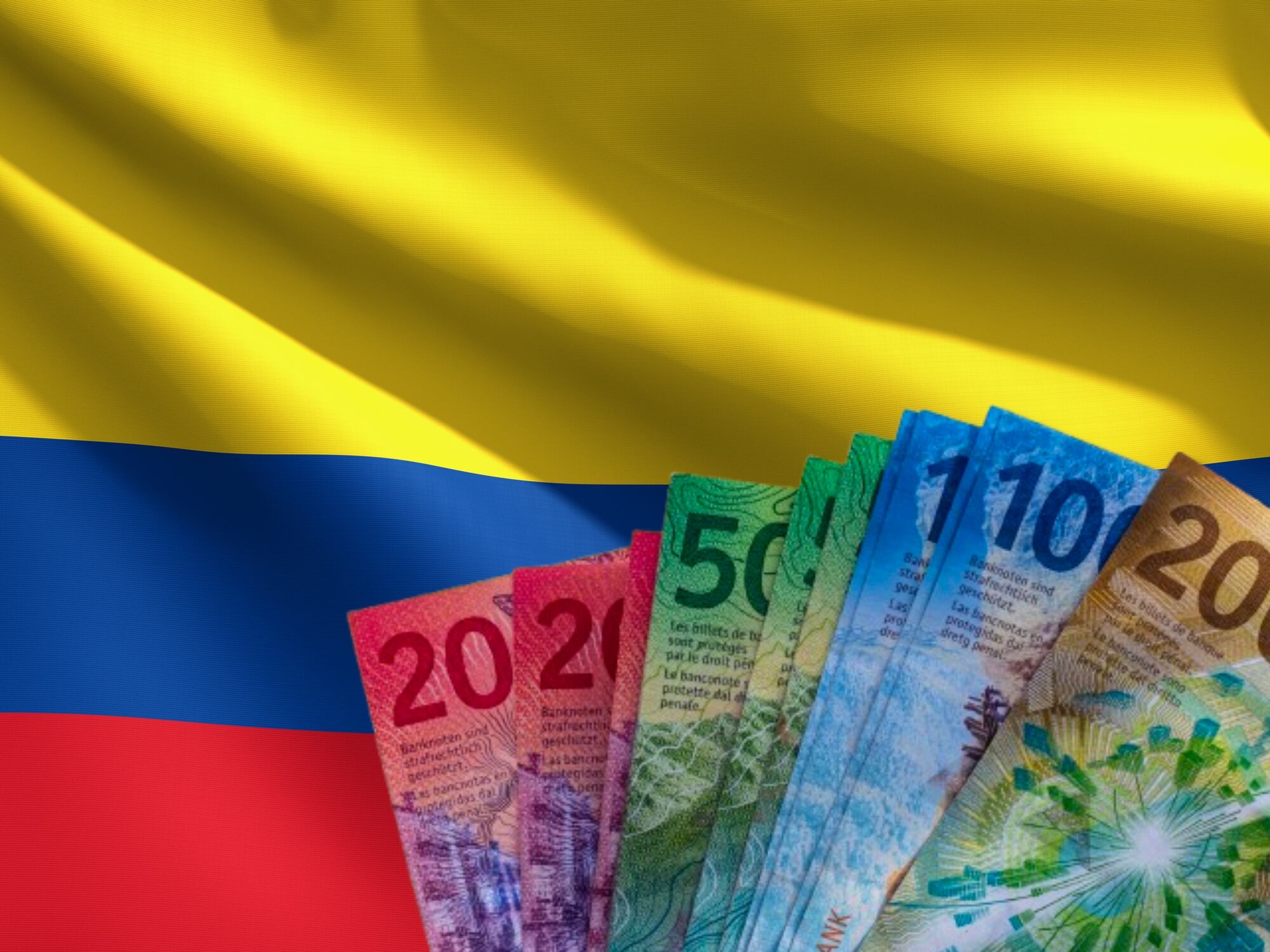 Bandera Colombia y francos suizos. Fotos: Getty Images
