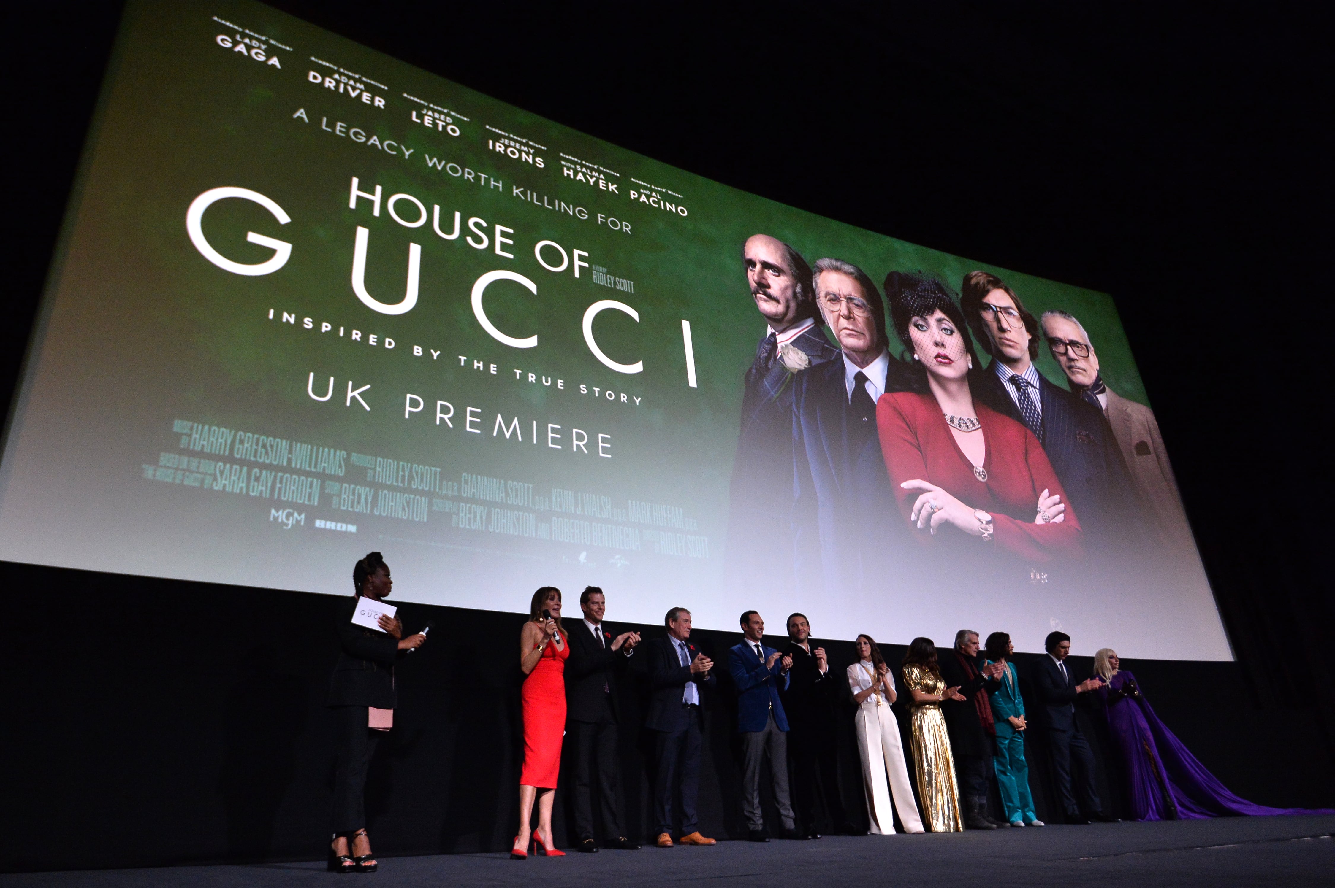 LONDON, ENGLAND - NOVEMBER 09: (L-R) Clara Amfo, Giannina Facio and Kevin Walsh, Mark Huffam, Roberto Bentivegna, Jack Huston, Camille Cottin, Salma Hayek, Jeremy Irons, Jared Leto, Adam Driver and Lady Gaga speak on stage before the UK Premiere Of "House of Gucci" at Odeon Luxe Leicester Square on November 09, 2021 in London, England. (Photo by Jeff Spicer/Getty Images for Metro-Goldwyn-Mayer Studios and Universal Pictures )