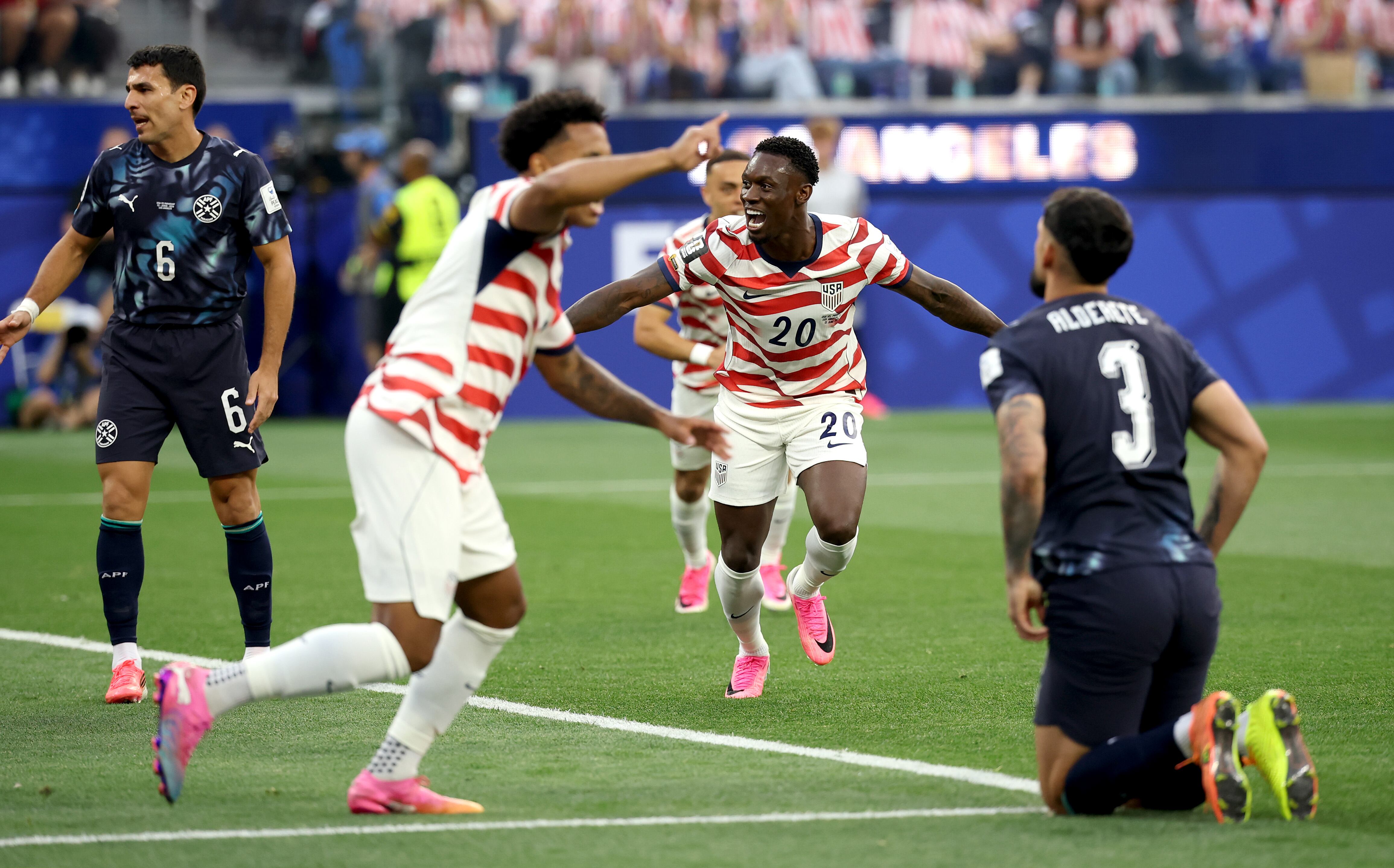 LOS ANGELES, CALIFORNIA - JUNE 12: Folarin Balogun #20 of the United States celebrates scoring his team's second goal during the FIFA World Cup 2026 Group D match between USA and Paraguay at Los Angeles Stadium on June 12, 2026 in Los Angeles, California. (Photo by Jared C. Tilton - FIFA/FIFA via Getty Images)
