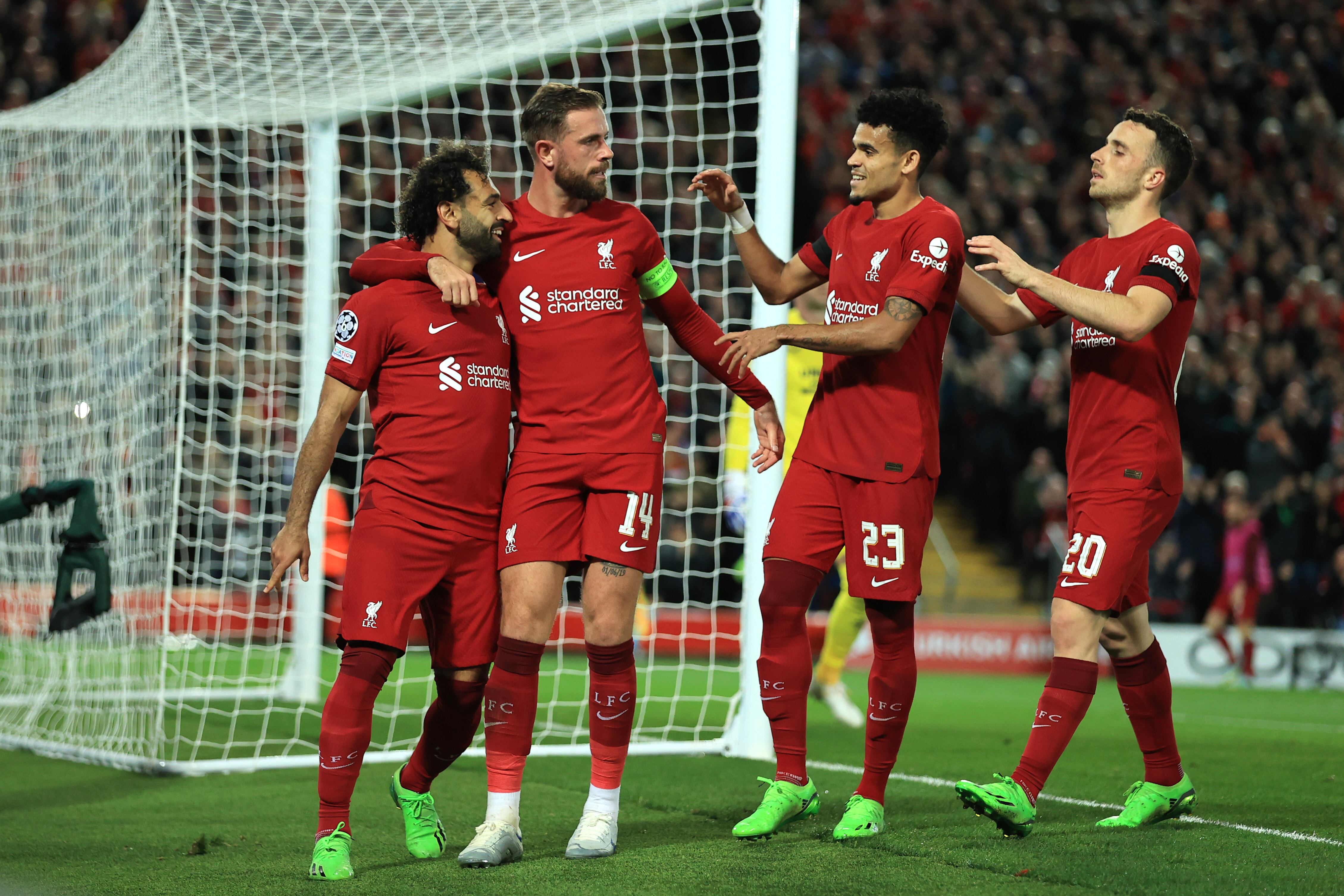 LIVERPOOL, ENGLAND - OCTOBER 04: Mohamed Salah of Liverpool celebrates scoring their 2nd goal from the penalty with Jordan Henderson, Luis Diaz and Diogo Jota spot during the UEFA Champions League group A match between Liverpool FC and Rangers FC at Anfield on October 4, 2022 in Liverpool, United Kingdom. (Photo by Simon Stacpoole/Offside/Offside via Getty Images)