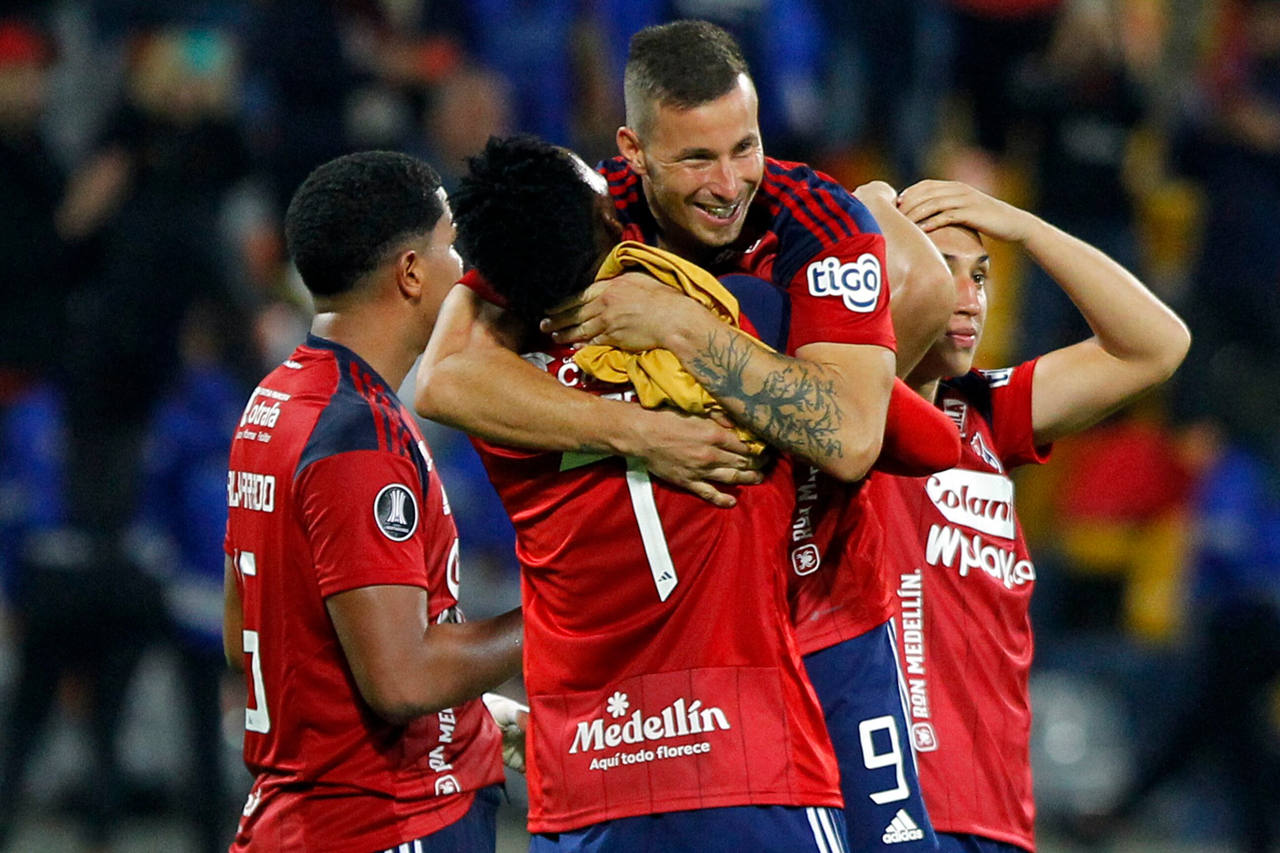 Independiente Medellin's players celebrate after defeating Magallanes during the Copa Libertadores third round second leg football match between Colombia's Independiente Medellin and Chile's Magallanes at the Atanasio Girardot stadium in Medellin, Colombia, on March 15, 2023. (Photo by Freddy BUILES / AFP) (Photo by FREDDY BUILES/AFP via Getty Images)