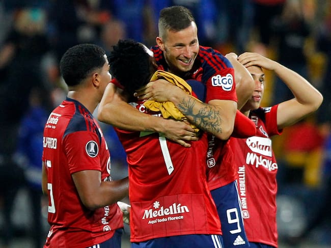 Independiente Medellin's players celebrate after defeating Magallanes during the Copa Libertadores third round second leg football match between Colombia's Independiente Medellin and Chile's Magallanes at the Atanasio Girardot stadium in Medellin, Colombia, on March 15, 2023. (Photo by Freddy BUILES / AFP) (Photo by FREDDY BUILES/AFP via Getty Images)