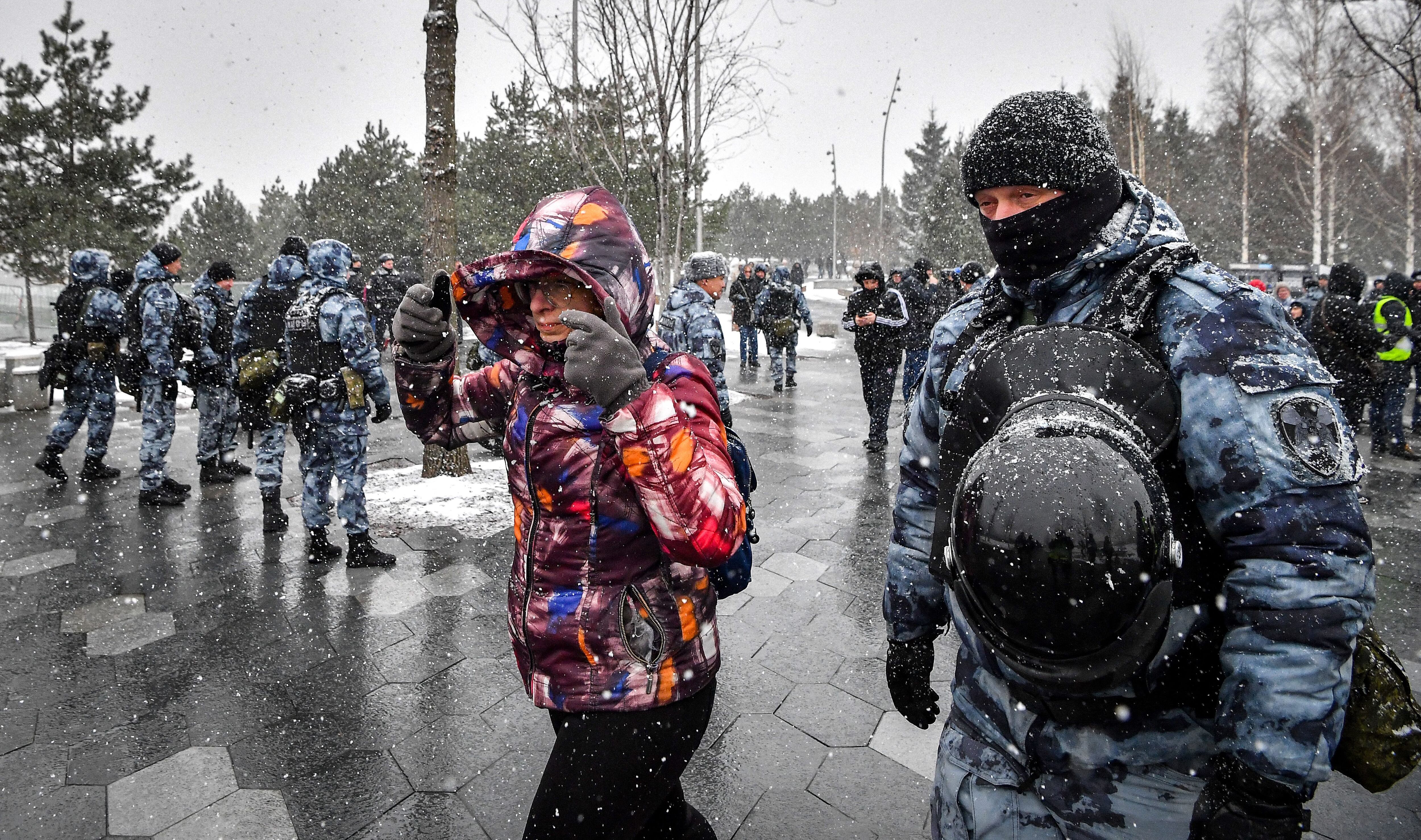 A Police officer detains a woman during a protest against Russian military action in Ukraine, in central Moscow on April 2, 2022. (Photo by AFP) (Photo by -/AFP via Getty Images)