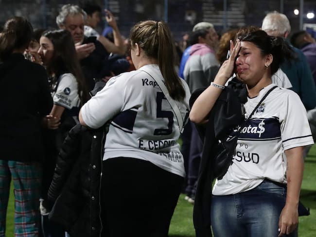 Fans of Gimnasia y Esgrima react after the incidents outside the Juan Carmelo Zerillo stadium during the Argentine Professional Football League Tournament 2022 match between Gimnasia y Egrima and Boca Juniors in La Plata, Argentina, on October 6, 2022. - This Thursday&#039;s match between Gimnasia y Esgrima and Boca Juniors was suspended 9 minutes into the first half due to serious incidents outside the stadium that affected the development of the match. (Photo by ALEJANDRO PAGNI / AFP) (Photo by ALEJANDRO PAGNI/AFP via Getty Images)