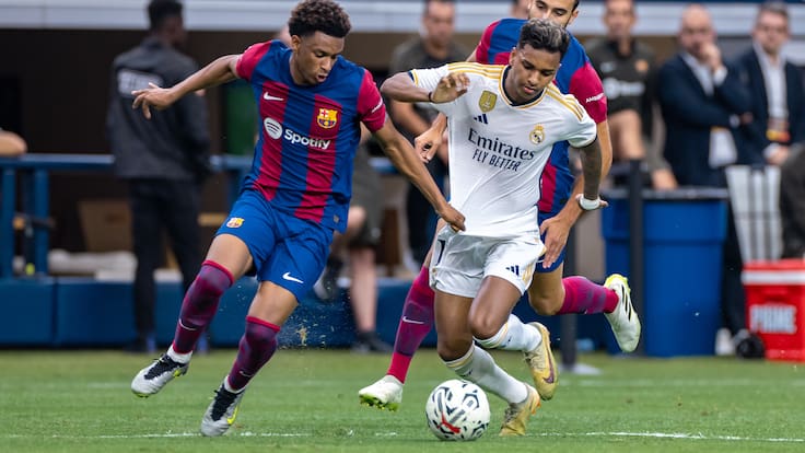 ARLINGTON, TX -  JULY 29: Real Madrid forward Rodrygo (#11) dribbles the ball up field as FC Barcelona defender Alex Balde (#3) defends during the Soccer Champions Tour match between Real Madrid and FC Barcelona on July 29, 2023 at AT&T Stadium in Arlington, TX.