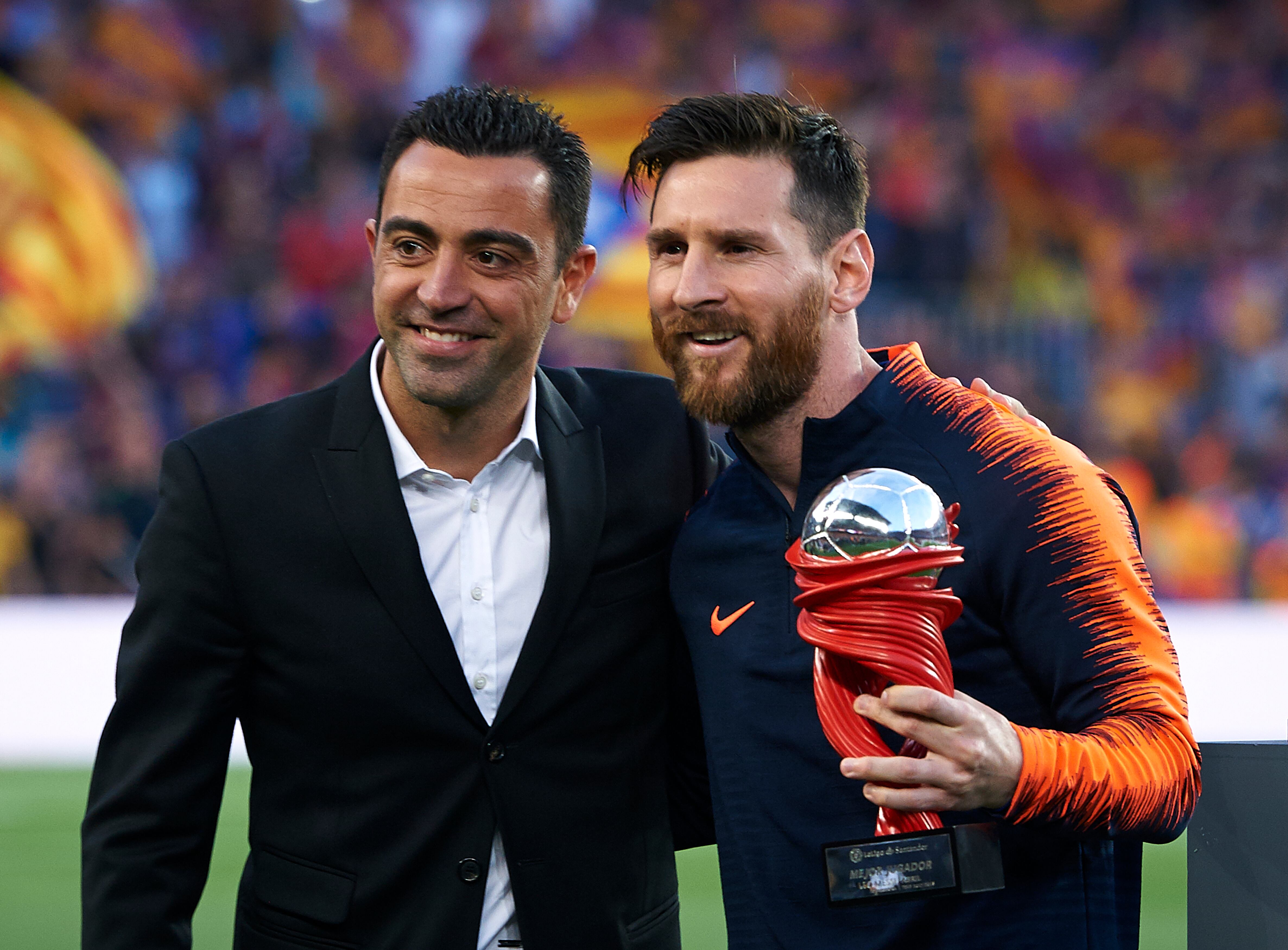 Xavi Hernández junto con Lionel Messi.  (Photo by Quality Sport Images/Getty Images)