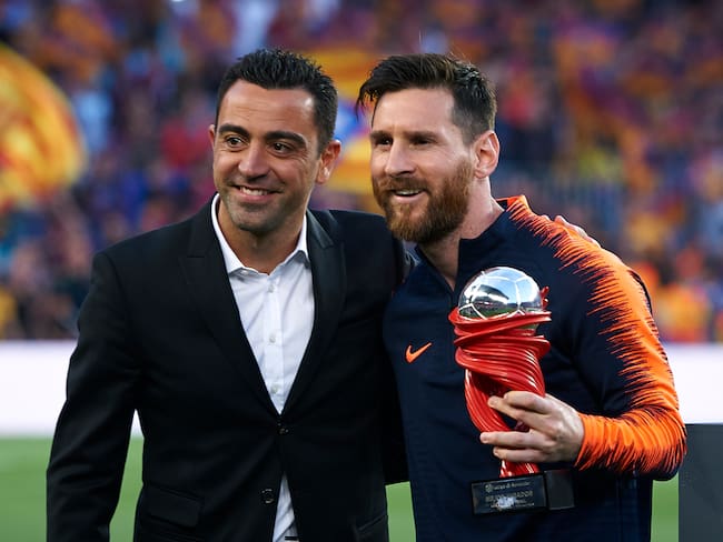 Xavi Hernández junto con Lionel Messi.  (Photo by Quality Sport Images/Getty Images)