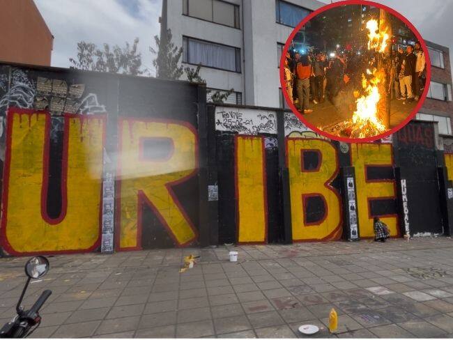 Juicio a Uribe: Manifestantes pintan mural cerca a la Universidad Javeriana en Bogotá