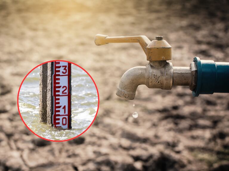 Llave del agua abierta sin agua / Marcador de nivel de agua en un río (Getty Images)