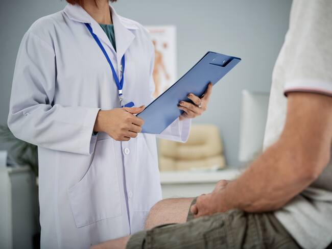 Medical practitioner asking patient questions from the list