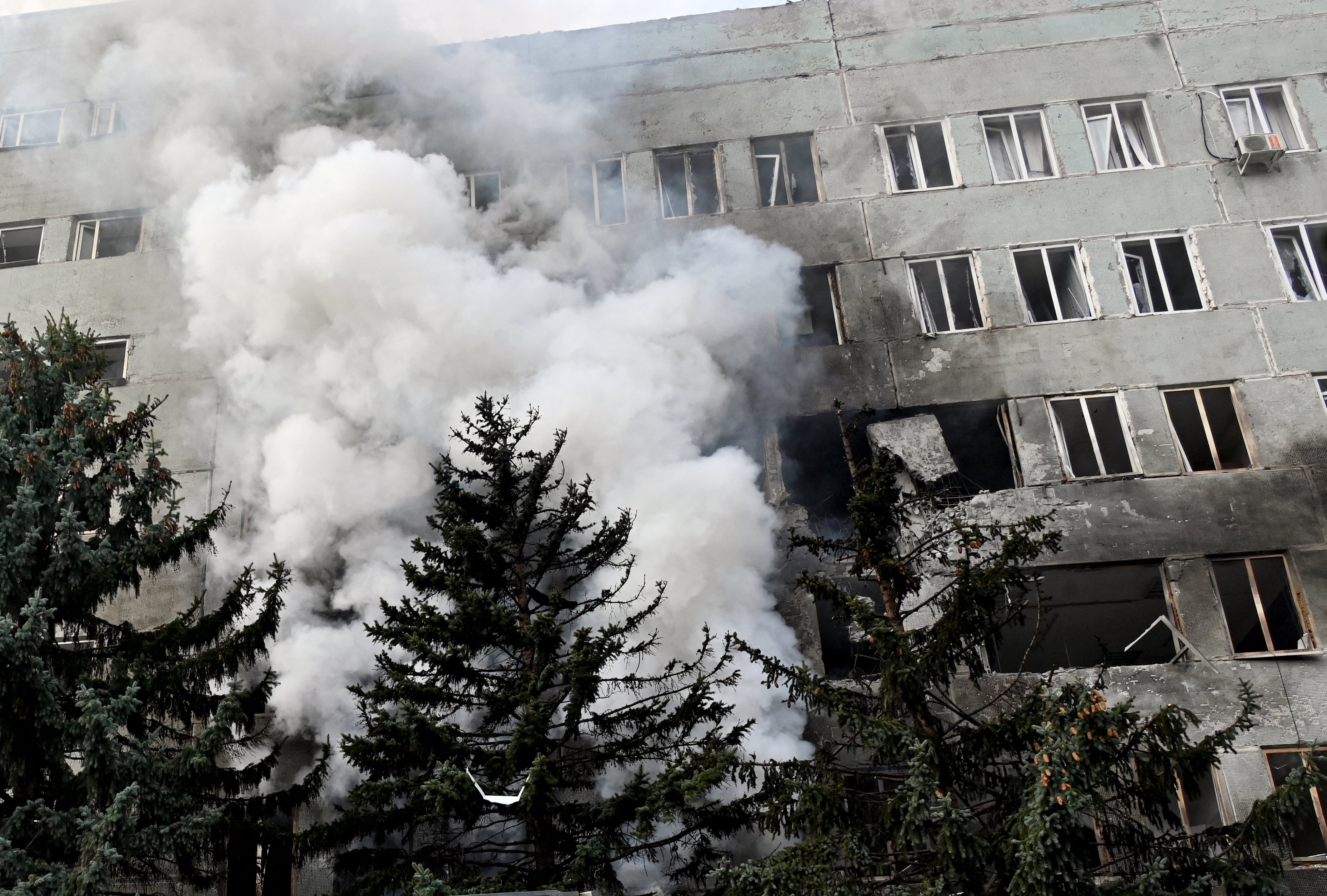 Smoke rises during a fire inside a clinic building after a Russian aerial attack on Kharkiv on October 10, 2026, as a result of which four people were wounded, amid the Russian invasion of Ukraine. (Photo by SERGEY BOBOK / AFP)