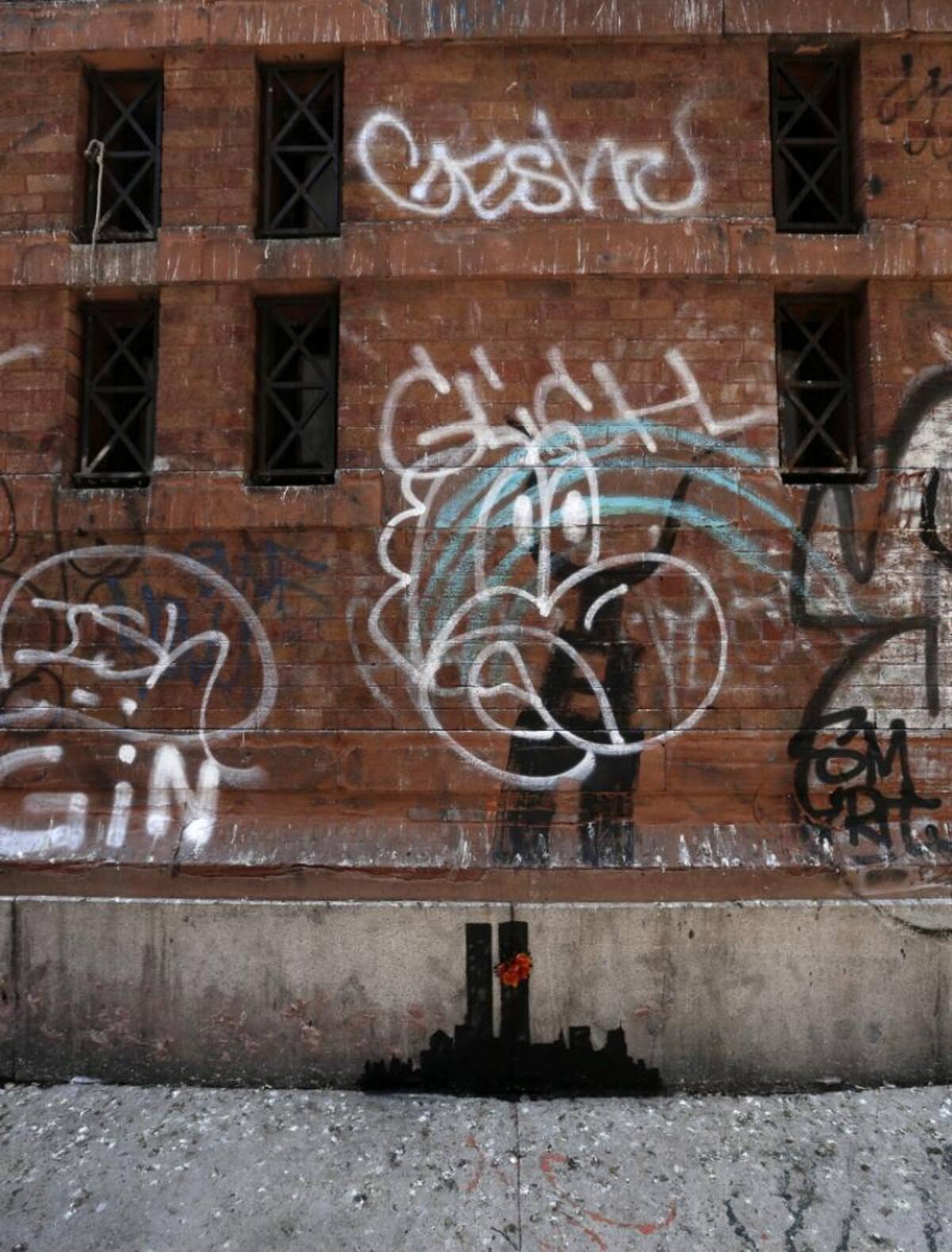 magen del graffiti "Torres gemelas en Tribeca" del artista callejero británico "Banksy".
