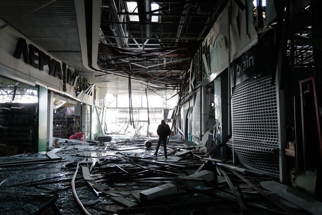 A man is seen inside a damaged shopping centre in the Podilskyi district of Kyiv by Russian air strikes, amid Russian invasion, in Kyiv, Ukraine, 21 March 2022. Russian invasions have forced millions of Ukrainians to become refugees fleeing to other countries. (Photo by Ceng Shou Yi/NurPhoto via Getty Images)